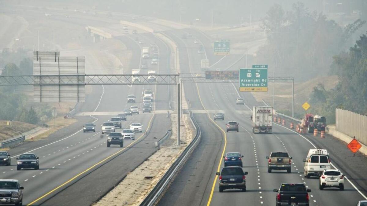 Smoke from the southern Appalachian wildfires hangs over I-75 at the Arkwright Road exit in Macon, Georgia on Monday, Nov. 14, 2016