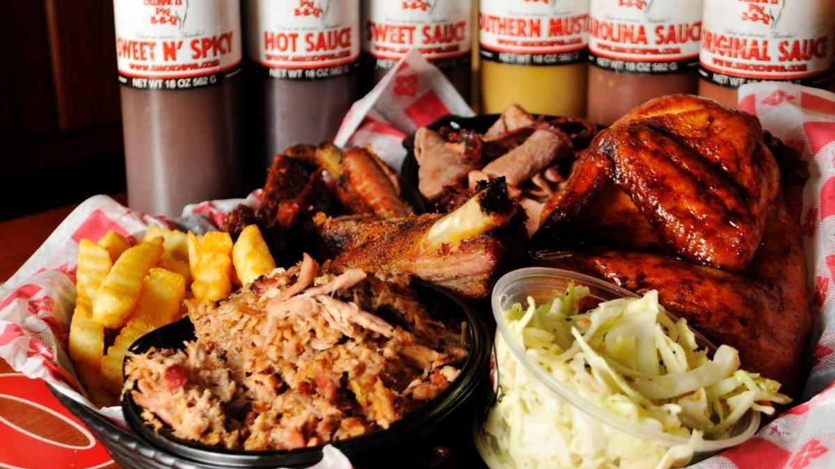 This combination plate from Smok’n Pig BBQ features pulled pork, ribs, beef brisket and a half chicken with sides of French fries and slaw.