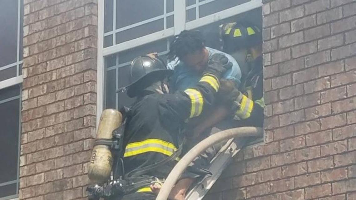Warner Robins firefighters battle a blaze at Lenox Pointe apartments on Karl Drive on Sunday, April 9, 2017. Firefighters rescued a woman from her burning apartment.