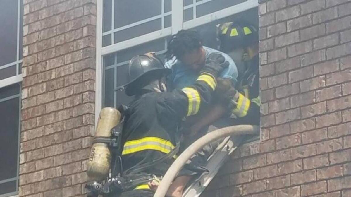 Warner Robins firefighters battle a blaze at Lenox Pointe apartments on Karl Drive on Sunday, April 9, 2017. Firefighters rescued a woman from her burning apartment.