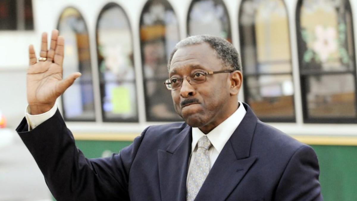 Georgia Sports Hall of Fame inductee James "J.T." Thomas waves as he arrives at the Macon City Auditorium prior to the 2011 induction ceremony.
