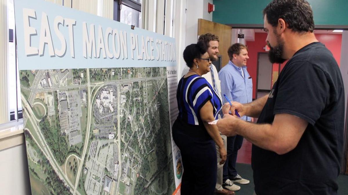 Pastor Jason Thomley places dots on a map of east Macon. The dots represent memories and dreams of the past, present and future of Mill Hill. The event is part of the east Macon Celebration three-day event hosted by Mill Hill: East Macon Arts Village and Macon Arts Alliance from Thursday through Saturday.