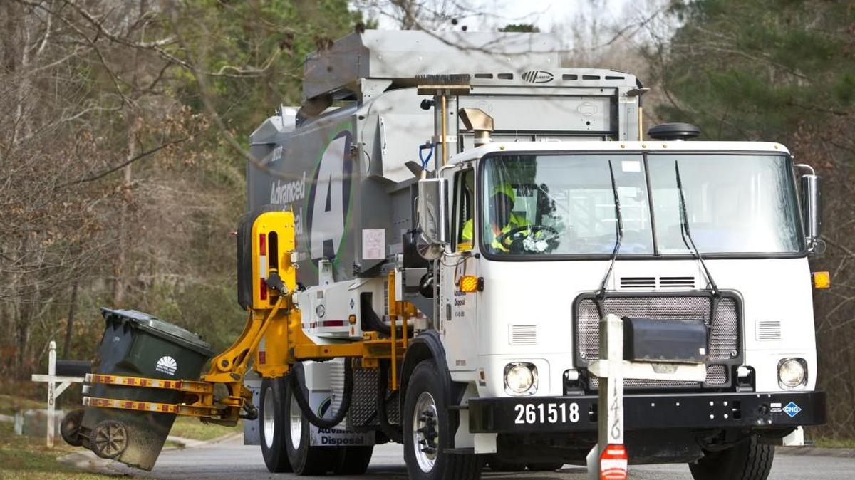 A garbage truck works in a Macon-Bibb County subdivision in this 2016 Telegraph file photo.