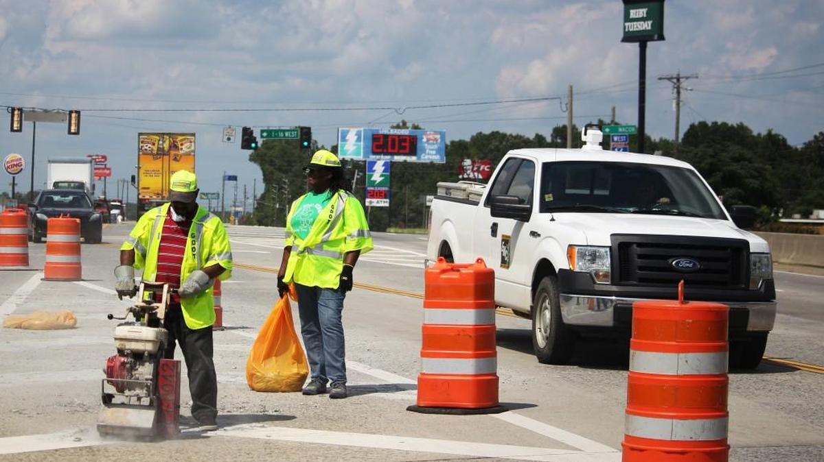 FILE PHOTO— Georgia Department of Transportation workers turn a chevron lane separation into a new lane for traffic while the left most lane is under construction. Those who normally take I-16 are encouraged to find alternate routes.