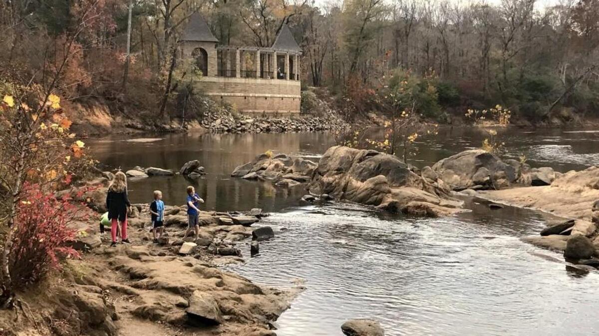Children skip rocks along the Ocmulgee River at Amerson River Park Nov. 23, 2016. The Ocmulgee River was at two feet below its normal range, according to the National Weather Service.
