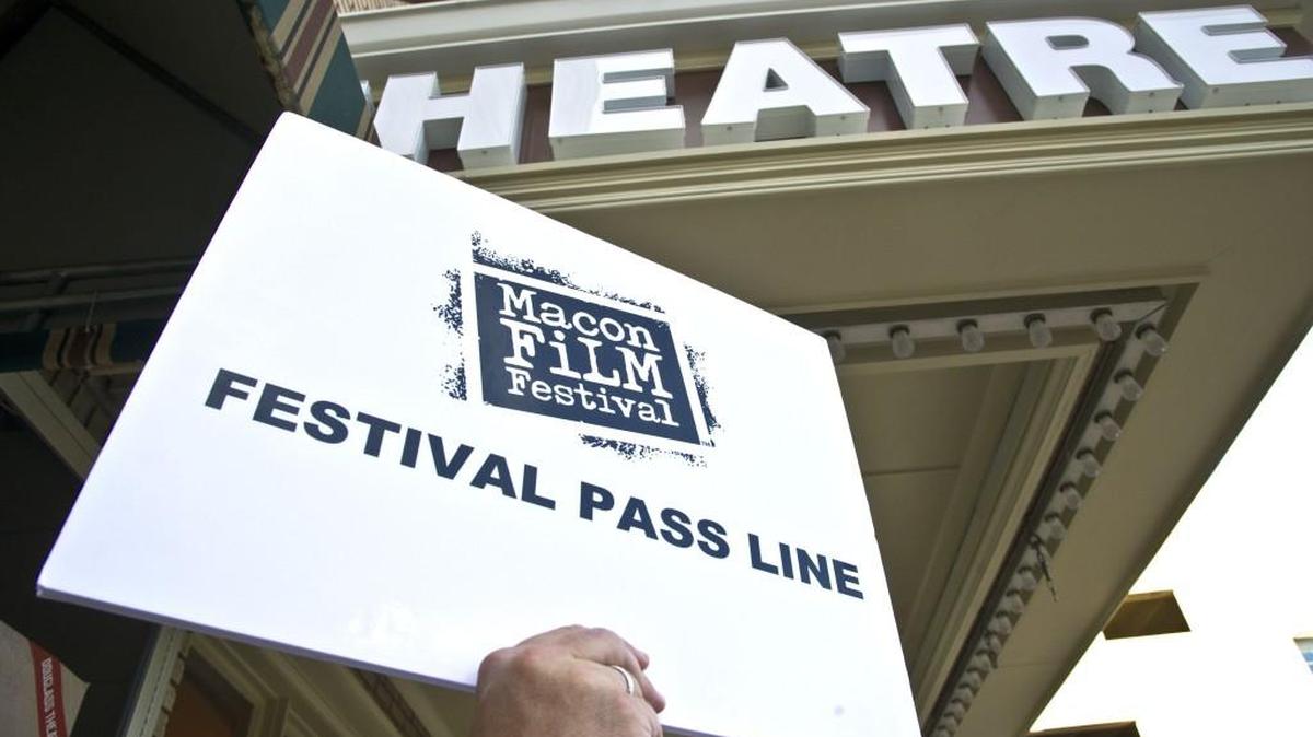 A Macon Film Festival volunteer helps people queue up for the 'Pretty in Pink' screening at the Douglass Theatre for the 2016 festival. This will be the first year a full-dome film will be shown during the Macon Film Festival.