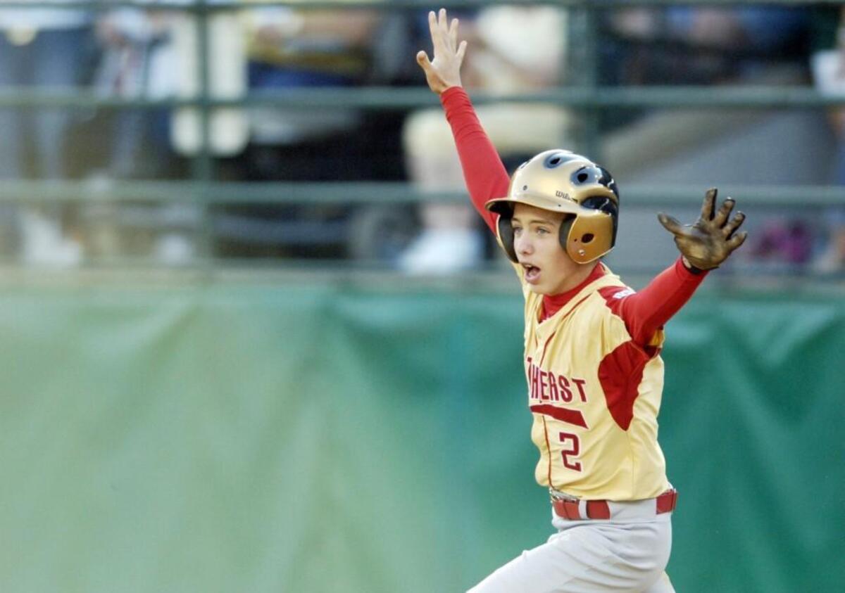 Warner Robins American Little League shortstop Dalton Carriker celebrates while rounding the bases after his walk off home run in the bottom of the eighth inning to win the Little League World Series 3-2 over Japan August 26, 2007.