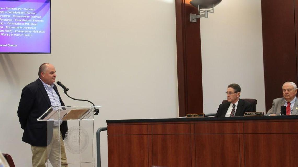 An an Oct. 18 meeting, Houston County Attorney Tom Hall, center, and Commissioner Tom McMichael, right, listen as Personnel Director Ken Carter explains a plan to audit the dependents on the county’s health insurance.