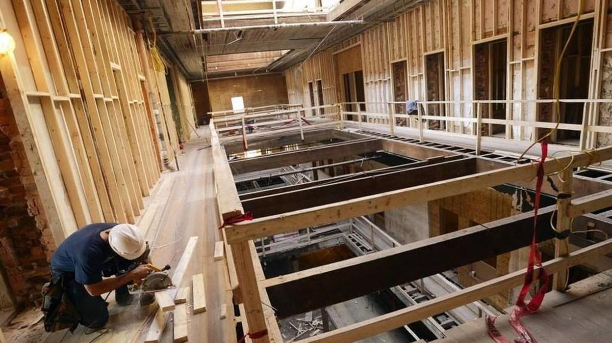 Steve Hubbard cuts wall studs for a one bedroom loft in the Dannenberg building in this Jan. 28, 2013, file photo. A proposed $55 million development could bring more apartments, a hotel, parking decks and retail space to downtown Macon around 2018.