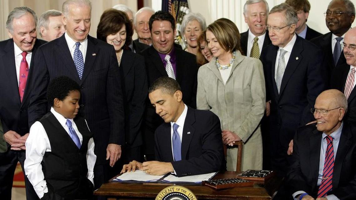 In this March 23, 2010 file photo, President Barack Obama signs the Affordable Care Act in the East Room of the White House in Washington.