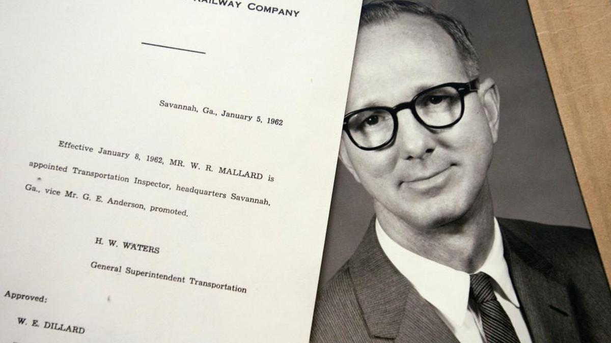 Old photograph of Bill Mallard with a promotion letter from Central of Georgia Railway Company.