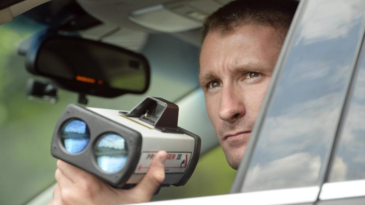 Former Centerville police Sgt. Paul Hollar holds an infrared laser gun while checking for speed violations in this 2014 Telegraph file photo. Starting Monday, officers in Georgia and four neighboring states are targeting speeders.