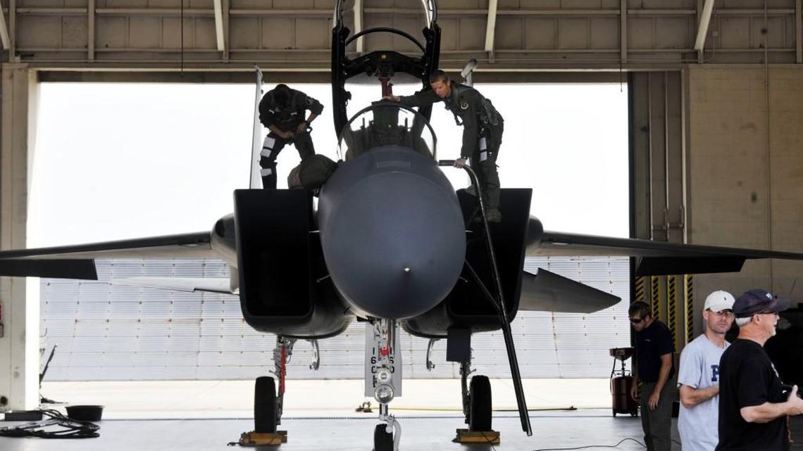 Lt. Col. Chris Coddington, right, and Lt. Col. Rick Sposato, left, prepare for a training flight on April 17, 2013 at Robins Air Force Base. Robins F-15 pilots will conduct a flyover of the Cherry Blossom Festival on Sunday, will do a second practice run Thursday.