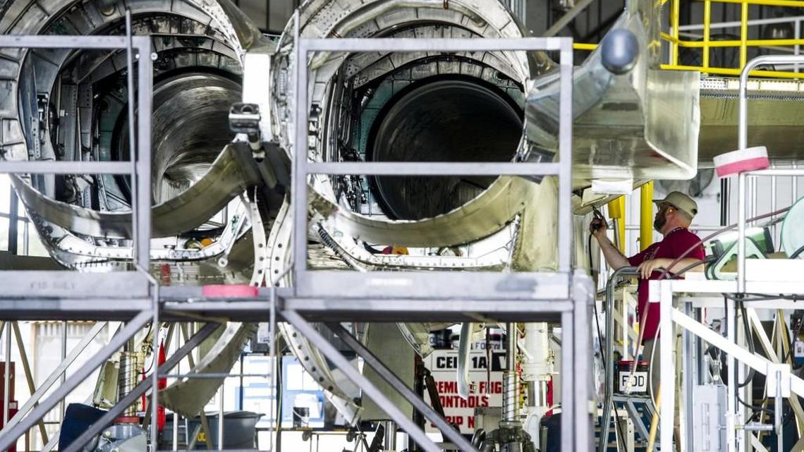 James Hall removes a panel from under the wing of an F-15 being repaired at Robins Air Force Base on Oct. 23, 2015.