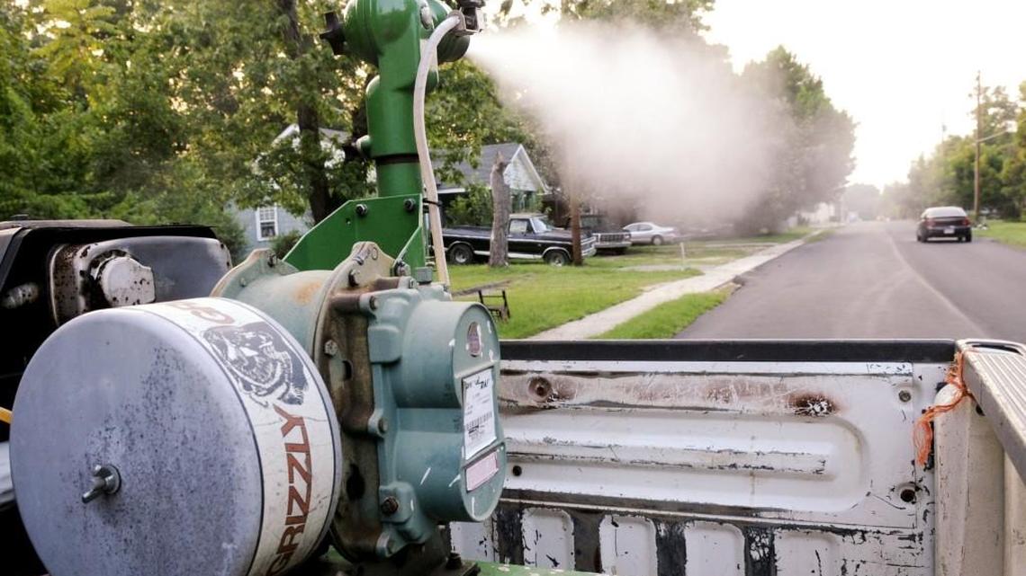 Don Ferguson with Warner Robins Public Works drives along Third Street while spraying for mosquitoes in this 2010 file photo.