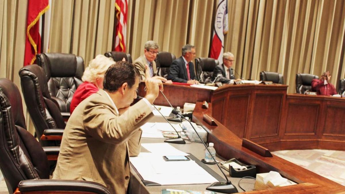 Warner Robins City Council members vote in favor of an ordinance amendment to implement a pay scale change for city employees.
