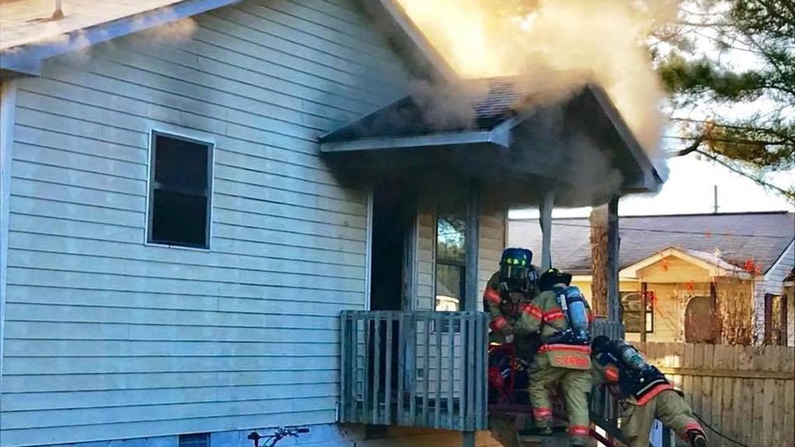 Perry firefighters battle a house fire on Whipple Street early Monday.