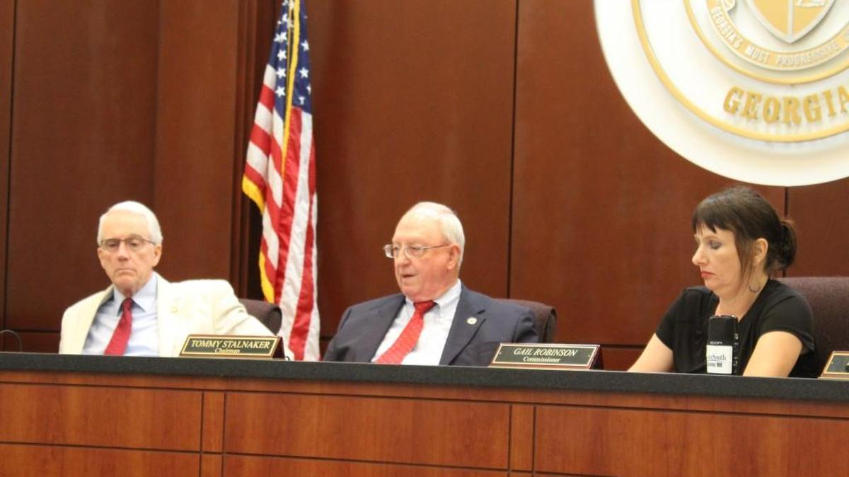 Houston County Commission Chairman Tommy Stalnaker expresses his concerns about the budget for next year at Tuesday’s commission meeting as commissioners Larry Thomson and Gail Robinson listen.