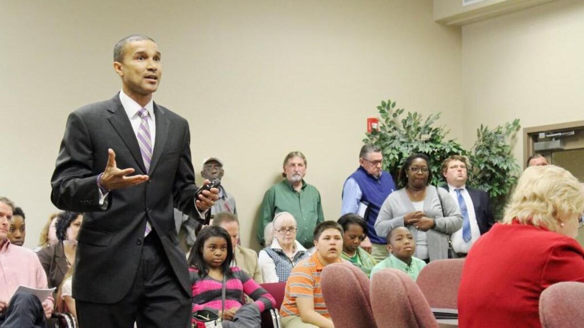 Amon Martin, a representative of Pennrose, speaks at the Feb. 6 Warner Robins City Council meeting about the company's plan to build a housing development near the veterans training center. A public hearing Thursday is tied to the company's application for low-income tax credits to build the complex.