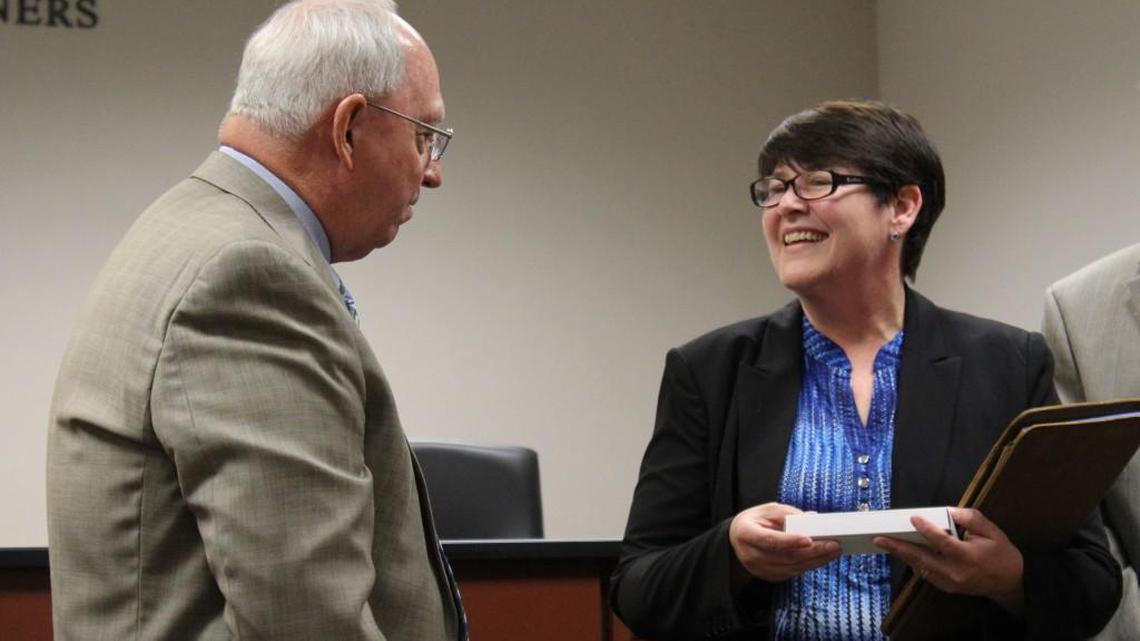 Houston County Commission Chairman Tommy Stalnaker talks to Claudia Meier after she was sworn in Tuesday as Houston County’s chief public defender.