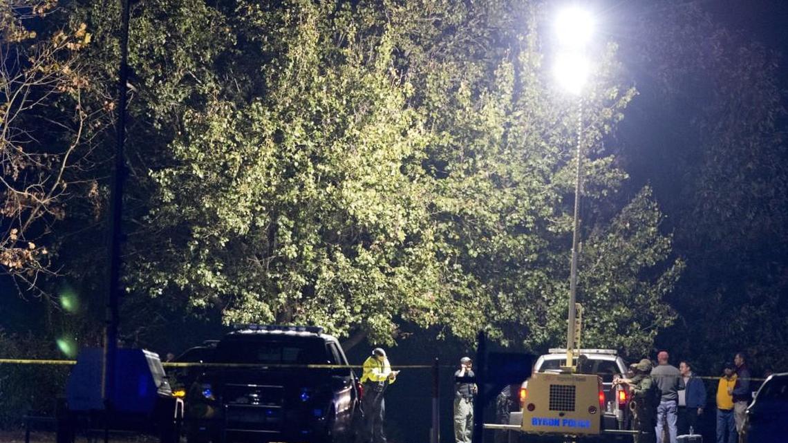 Emergency personnel investigate a shooting on Hardison Road in Byron after two Peach County deputies were shot responding to a domestic incident Sunday evening, authorities said.