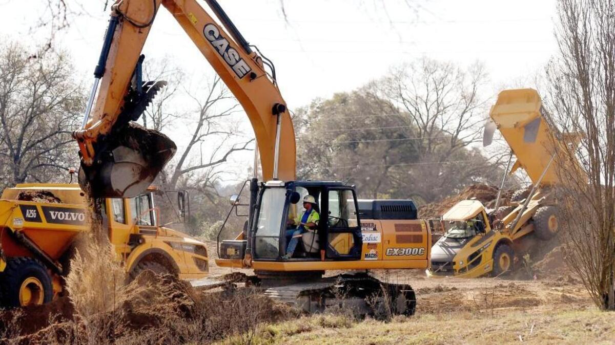 Contractors move soil after a groundbreaking ceremony on the first phase of a new Air Force Reserve Command consolidated mission complex Thursday at Robins Air Force Base.