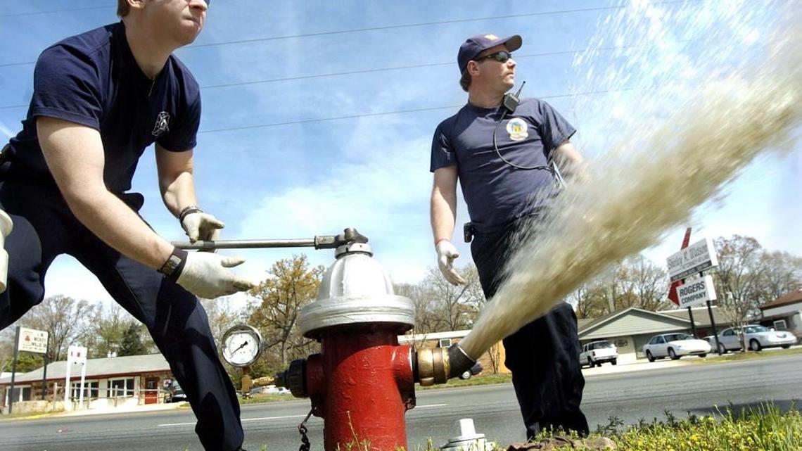 Warner Robins firefighters, Lt. Tracey Joyner, wearing a ball cap, and Robert Alley, check a fire hydrant on Watson Boulevard in Warner Robins in this 2005 Telegraph file photo. Firefighters check the hydrants each year, making sure they have proper water pressure and work properly.