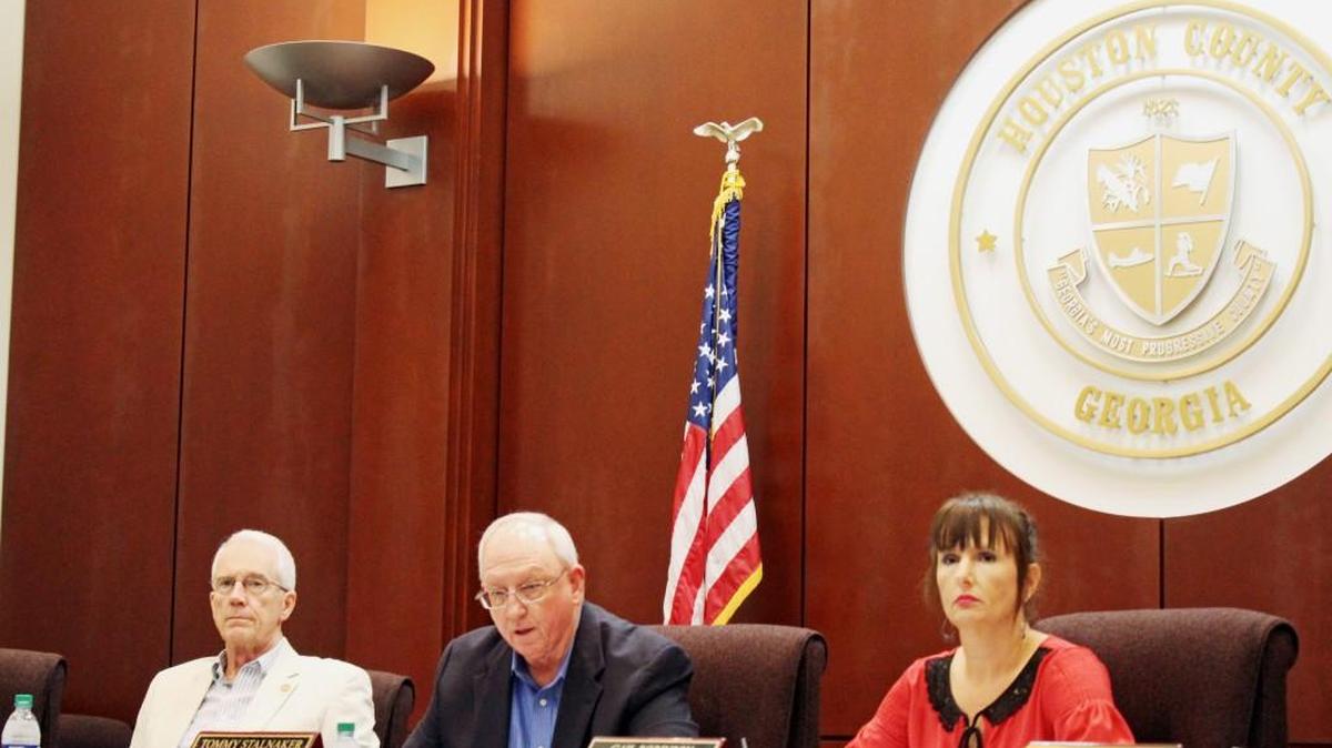 Houston County Commission Chairman Tommy Stalnaker, center, discusses the tax digest figures Tuesday as commissioners Larry Thomson and Gail Robinson listen.