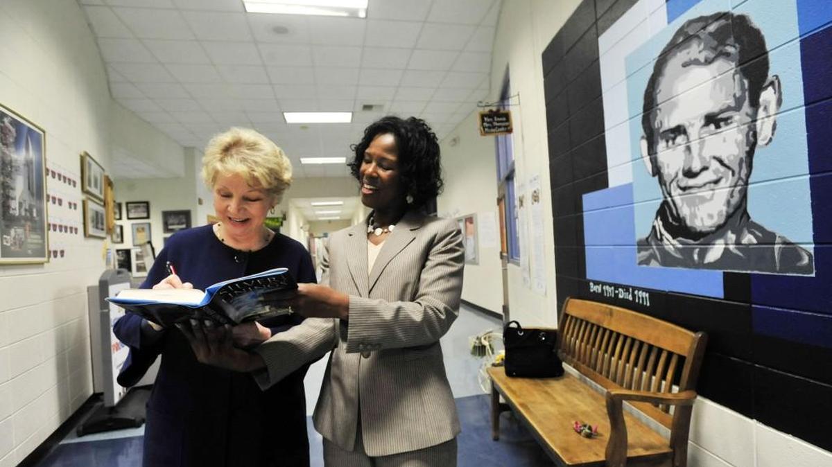 June Scobee Rodgers, left, autographs her memoir for Sonny Carter prinicipal Latricia Reeves before speaking to the Rotary Club in 2011 in this Telegraph file photo. Rodgers, whose husband Dick Scobee was the commander of the Challenger space shuttle that exploded just after takeoff in January 1986. The former elementary school teacher started the Challenger Centers for Space and Science Education in April of 1986 to memorialize the crew.
