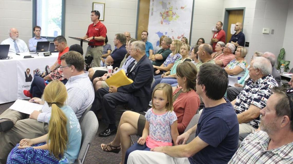 Chad Bryant of Ocmulgee Inc. speaks to Perry City Council on Tuesday in favor of the annexation and rezoning of a 107-acre tract planned for a subdivision. Most of the audience was opposed.