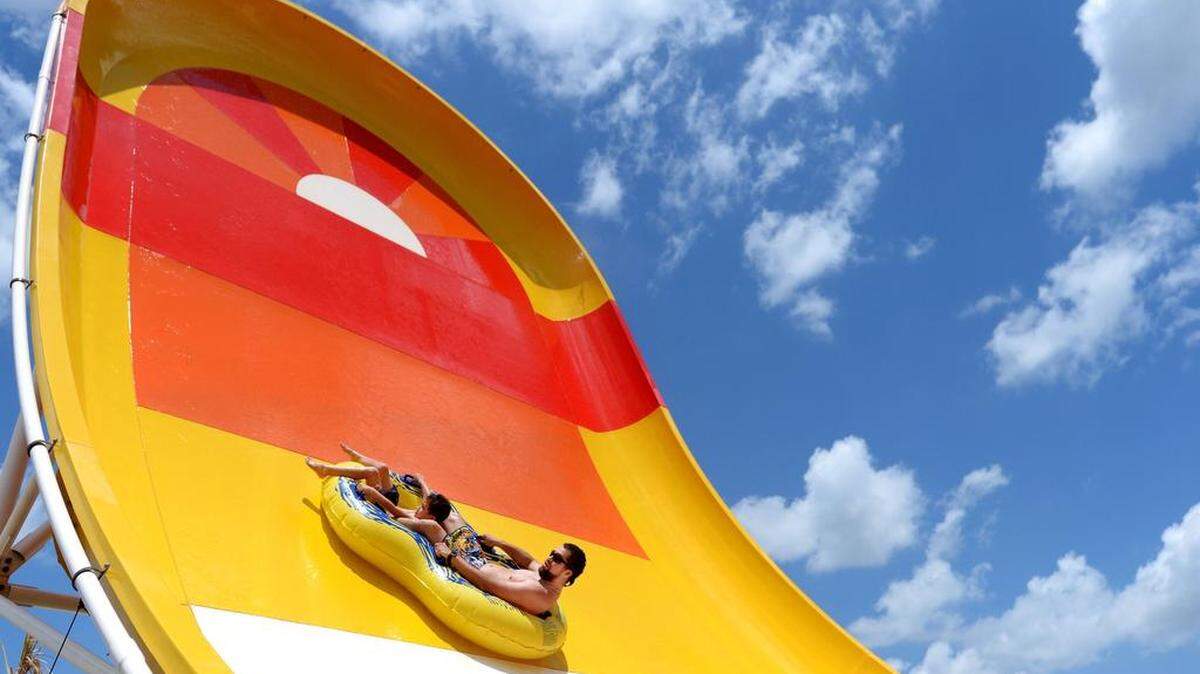 Visitors try out a ride at Rigby’s Water Park earlier this year. The park closed part of last week after a child who had been to the park tested positive for a parasite.