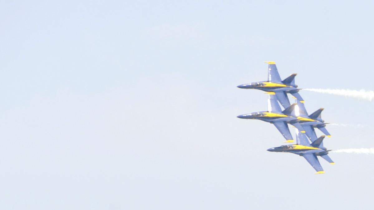 The U.S. Navy Blue Angels fly over a record crowd during the 2012 Robins Air Show Saturday at Robins Air Force Base.