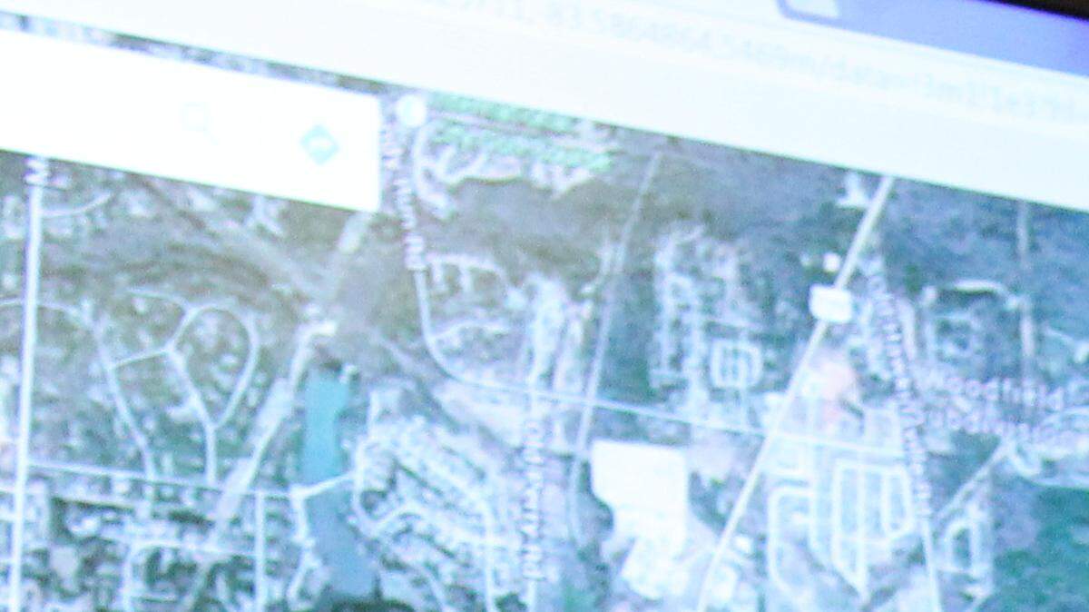 Developer Merg Hoffman and real estate agent Scott Free discuss plans for a project near Bonaire to be anchored by a Publix grocery store.