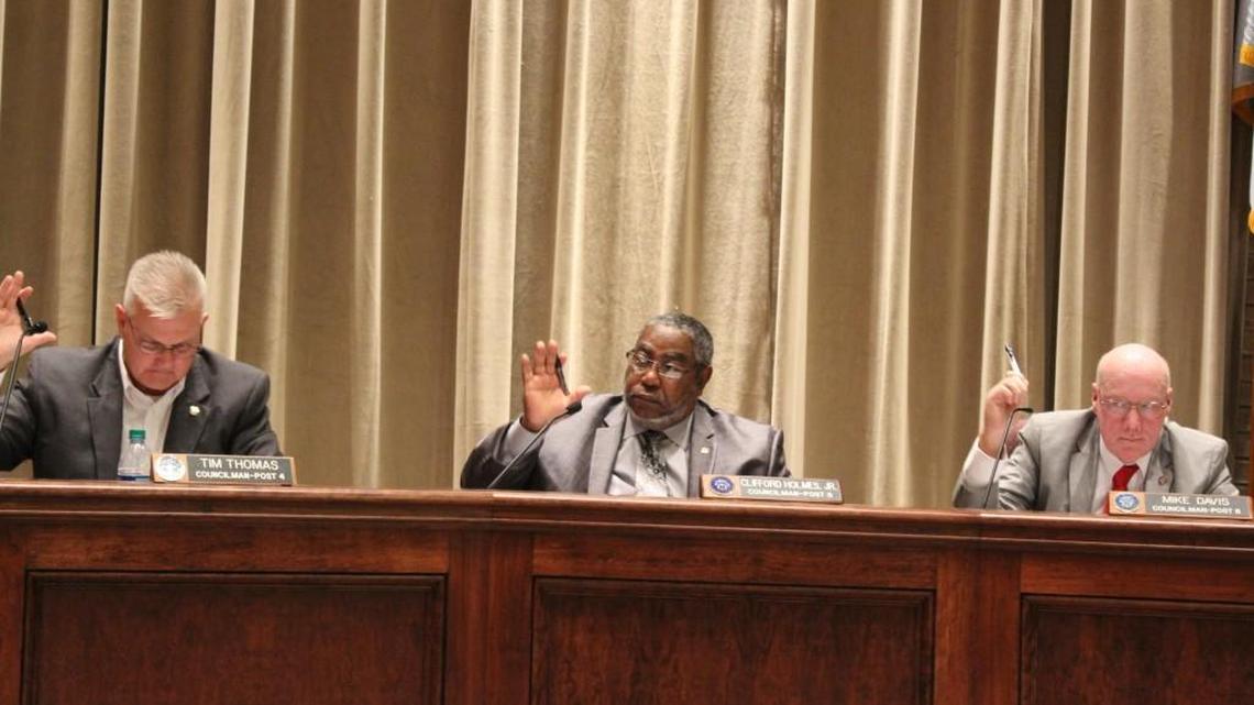 From left, Warner Robins City Council members Tim Thomas, Clifford Holmes and Mike Davis cast a vote at Monday's meeting.