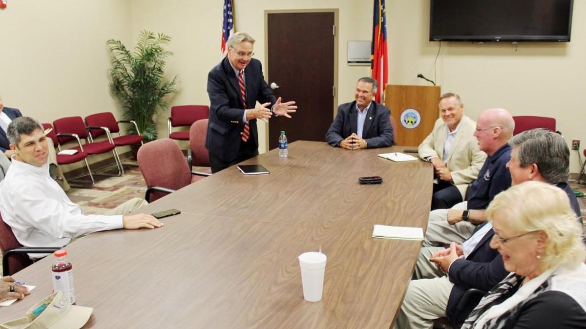 Tim Golden, district representative on the Georgia Department of Transportation board, gets a laugh during a meeting with elected officials in Warner Robins on Thursday.