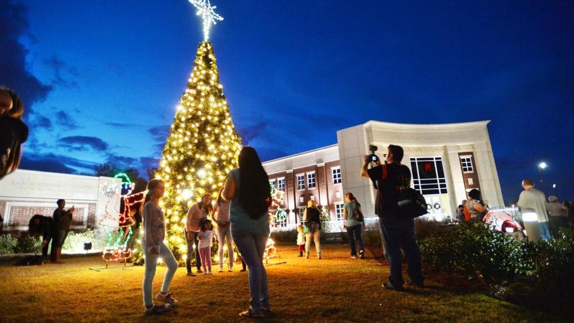 Families attending the 2015 Christmas tree lighting couldn’t resist taking pictures in front of the tree. The 2016 lighting is set for Nov. 29.