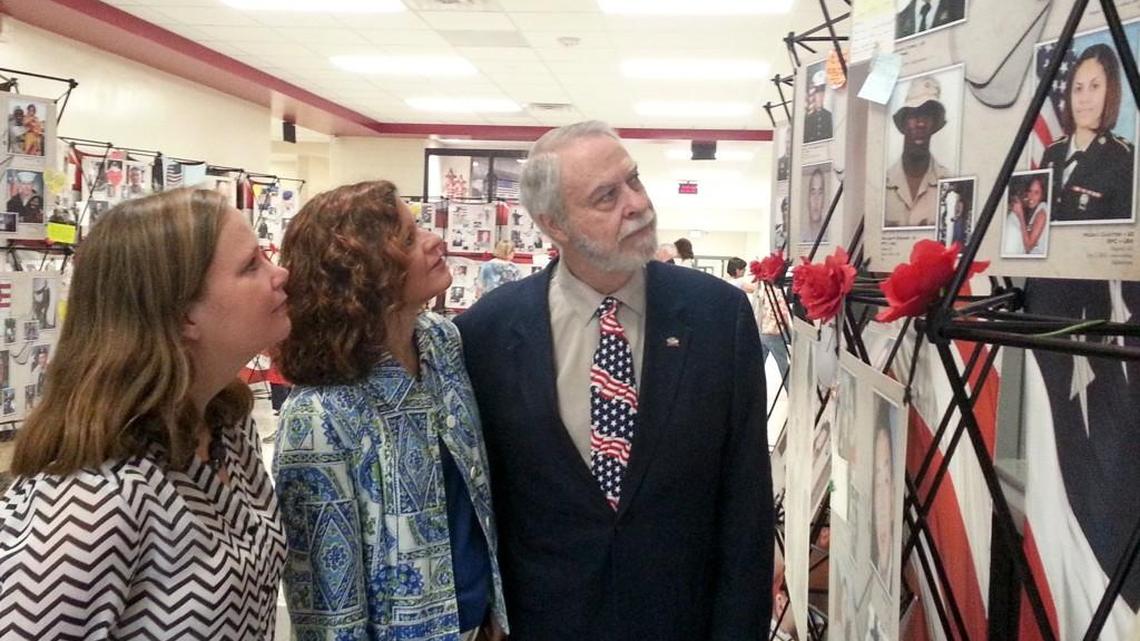 Fred Hardin, right, is seen in this 2015 Telegraph file photo as he looks at a memorial display during a tour of the renovated Pearl Stephens Elementary School. Also picture are Tennille Weatherford Scroggins and Sheila Clopton.