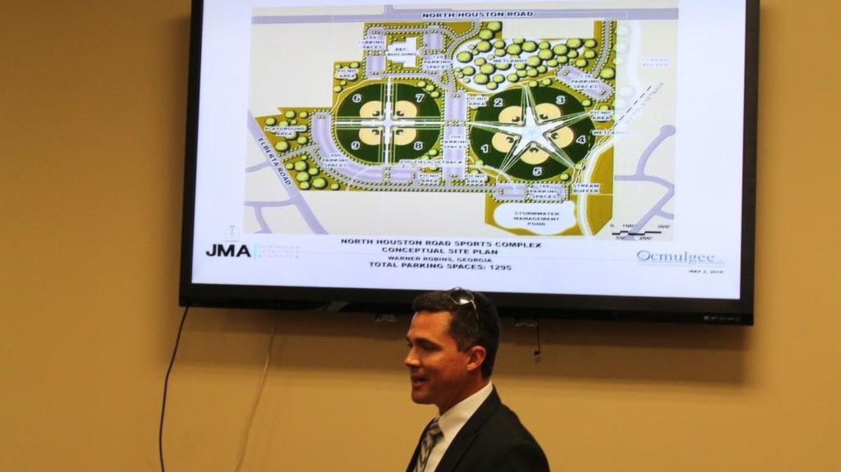Chad Bryant, a civil engineer with Ocmulgee Inc., talks about a concept plan by JMA Architecture, for a sports complex in Warner Robins.