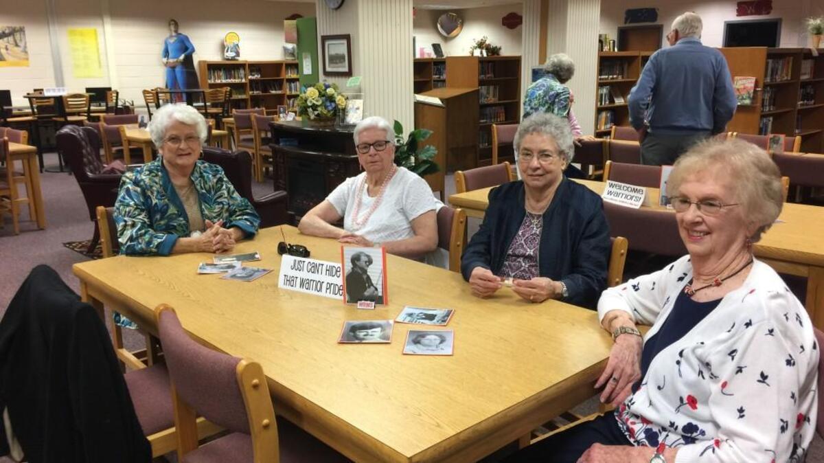 Warner Robins Middle and Junior High schools retired lunchroom workers pose for a photo at an event celebrating both the school’s legacy and its future.