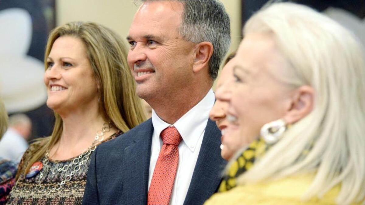 Warner Robins Mayor Randy Toms poses for pictures after final results from Tuesday's election were announced at a campaign party.
