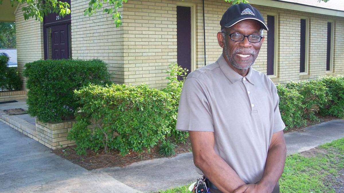 Gill Gordon, pastor of Greater Victory Church, stands in front of the congregation’s new location on South Houston Road.