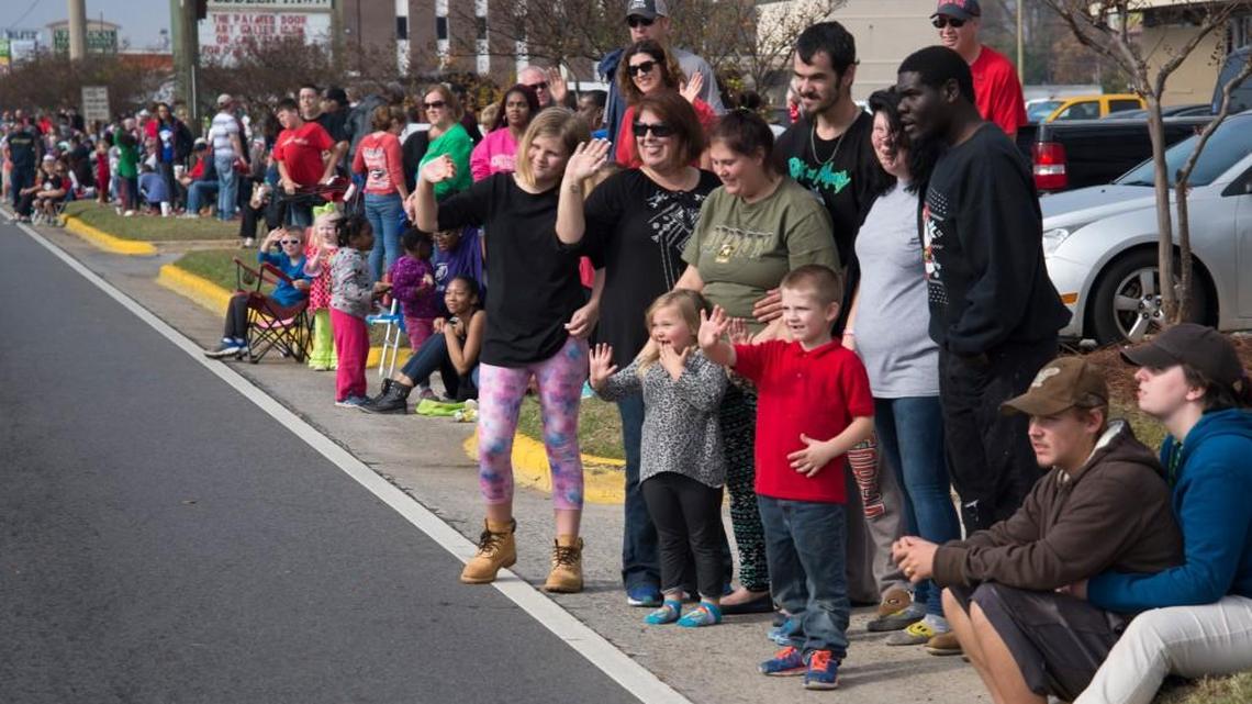 The crowd on Watson Boulevard waves at Santa Claus during the Robins Regional Christmas Parade in this Telegraph file photo.