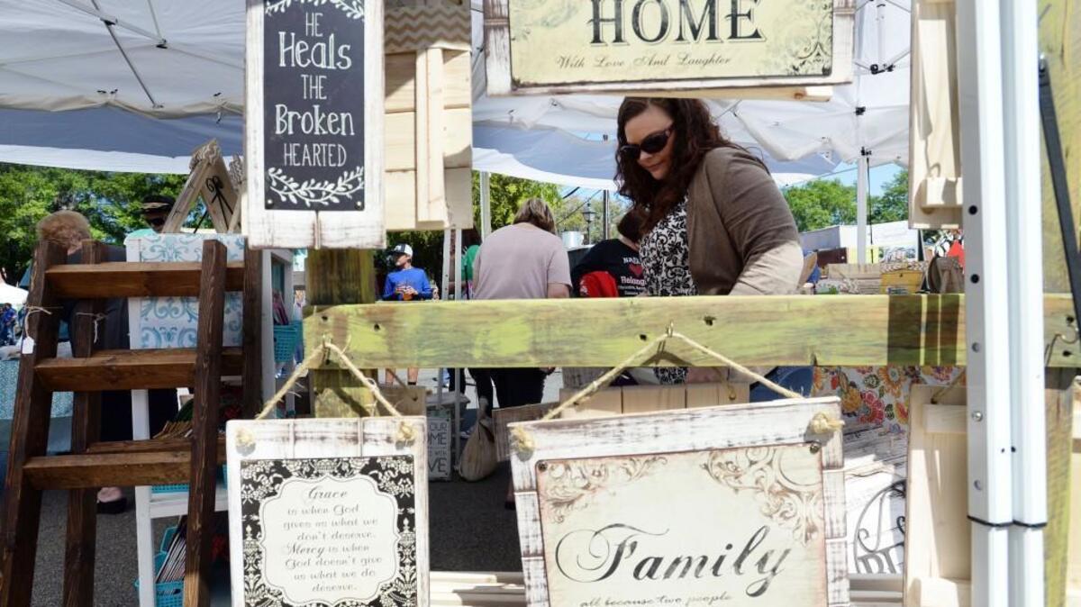 Visitors to the 2017 Dogwood Festival check out arts and crafts booths.