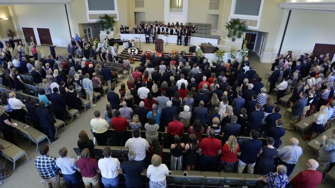 The family of the late Warner Robins High School Principal Steve Monday proceeds into the Central Baptist Church for services on Saturday.