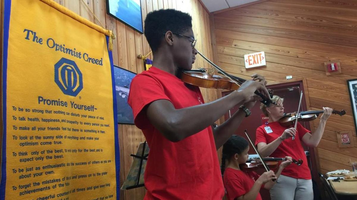Rayvon Love, Gianna Bourgeious and Julia Wiley perform at the Warner Robins Noon Optimist Club meeting.