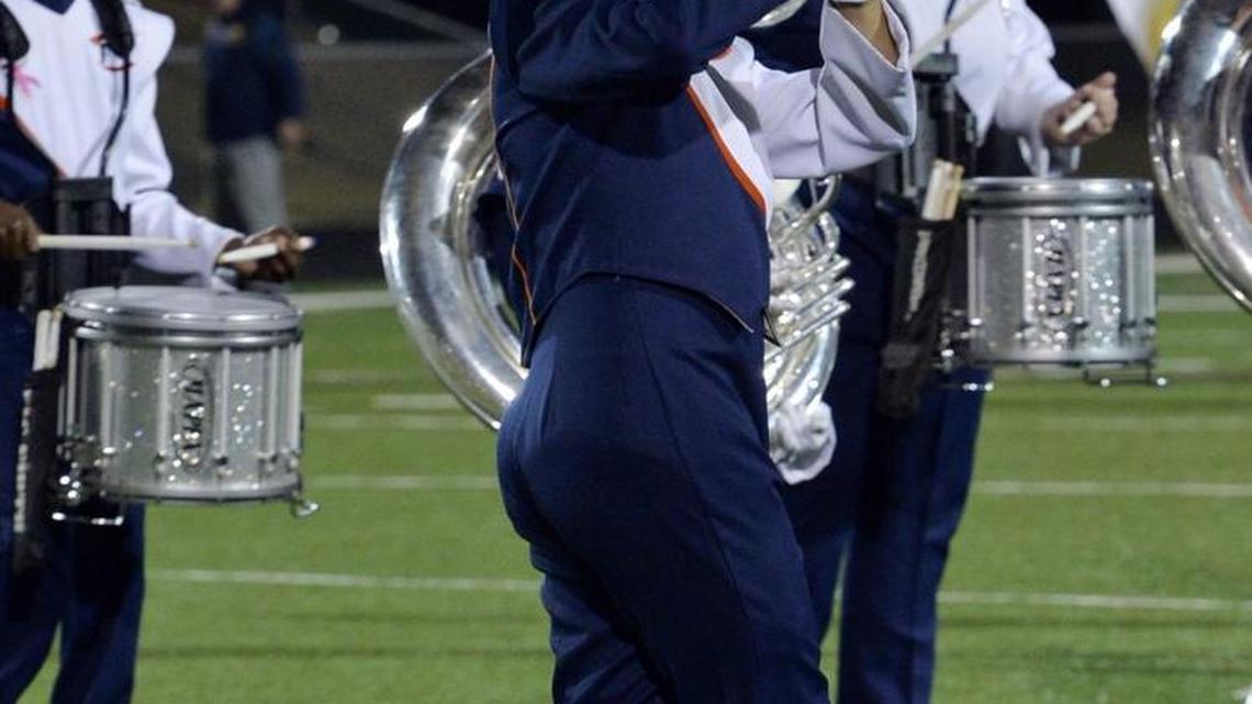 Members of the Northside High School marching band play during halftime of the school’s game Friday against Lee County.