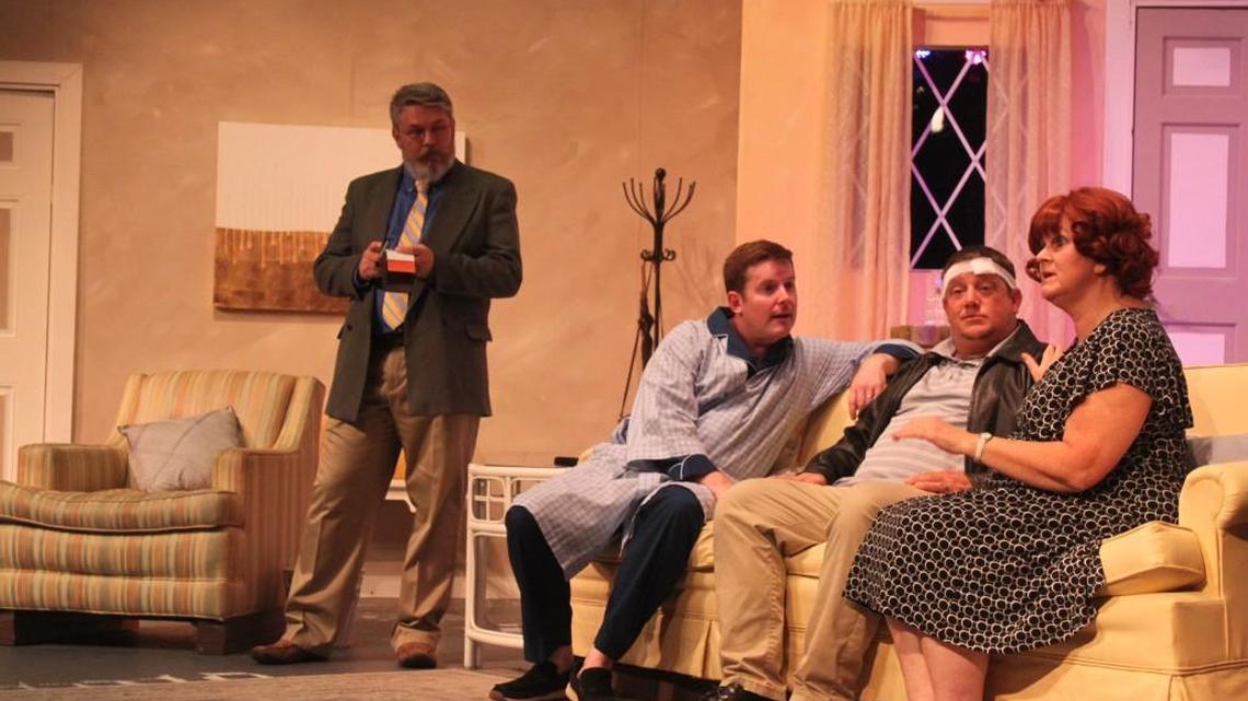 Detective Troughton, played by Dan Rhoades, left, questions from left, Stanley Gardner, played by Mark Strandburg, taxi driver John Smith, played by Chris Kemp, and Mary Smith, played by Kris Webling, in Perry Players’ production of “Run For Your Wife.”