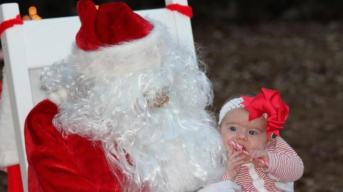 Santa Zach with his cousin Addisyn Williams during last year’s event.