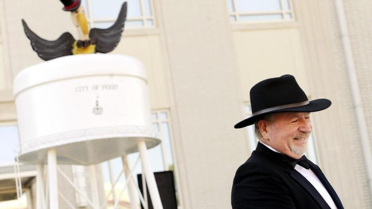Perry mayor Jimmy Faircloth cracks a smile in Oct. 2013, after announcing the City of Perry’s New Year's Eve Buzzard Drop.