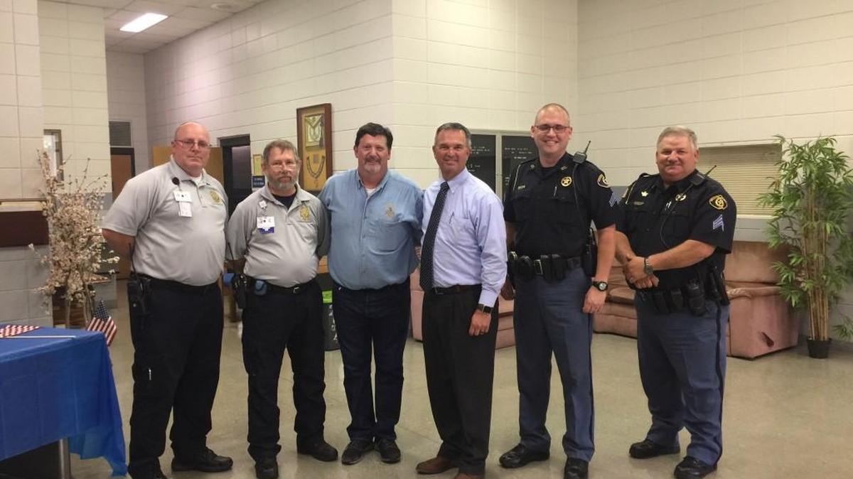 First responders pose with Tyrian Lodge's Worshipful Master Michael Doyle and Mayor Randy Toms.